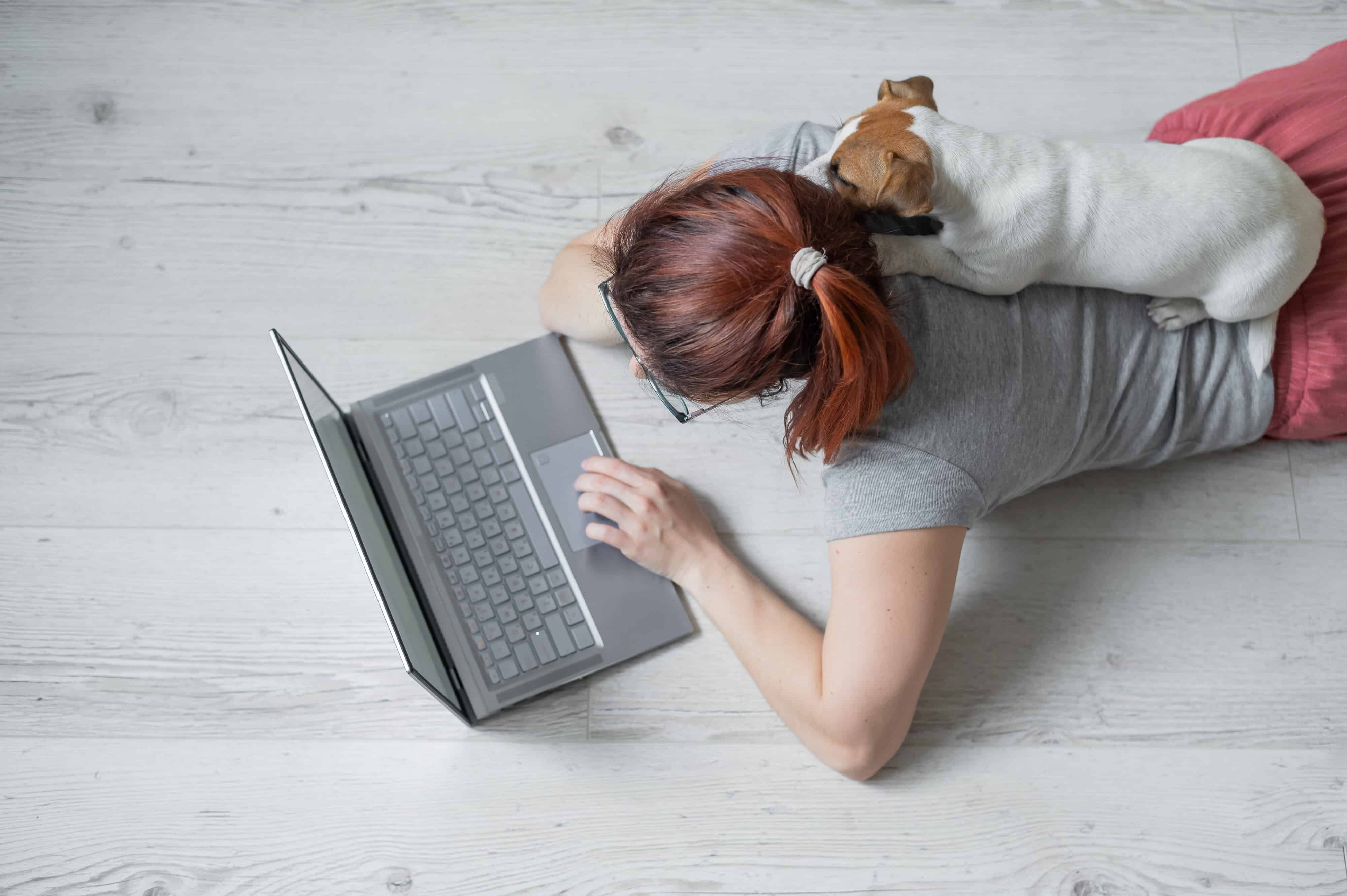student studying with dog